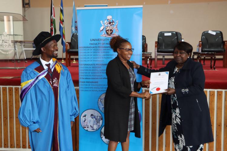 (Center) Dr. Margaret Kilonzo being awarded