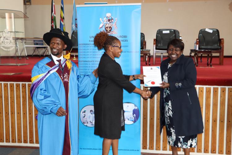 (Center) Dr. Margaret Kilonzo being awarded