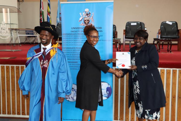 (Center) Dr. Margaret Kilonzo being awarded